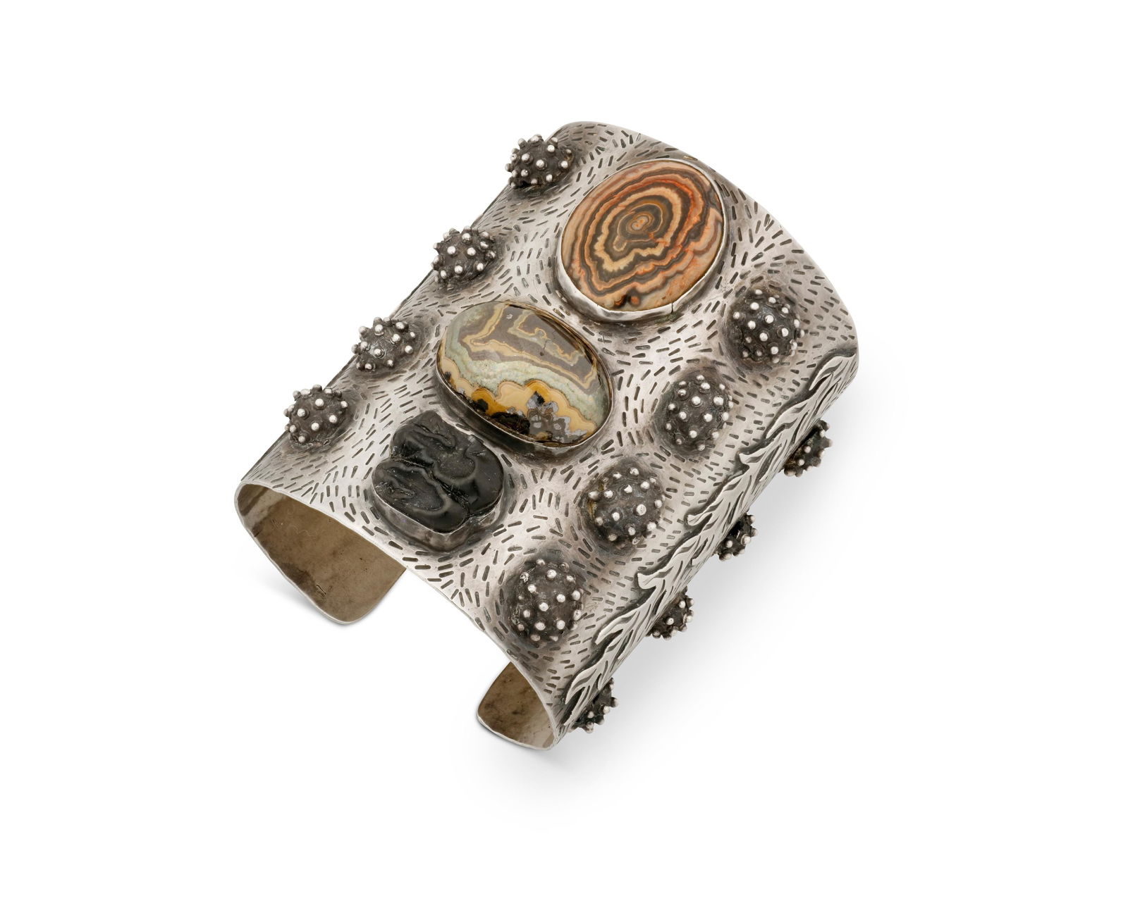 A Victoria Maase Stoll silver cuff bracelet: A Victoria Maase Stoll silver cuff braceletVictoria Maase Stoll (b. 20th century)Late 20th centuryStamped: VM Stoll / © / Santa FeA chunky sterling silver gauntlet cuff with multiple rows of incised
