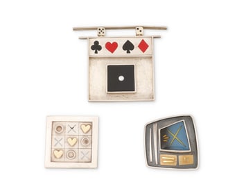 A group of MCM-style silver jewelry