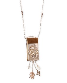A Christi Anderson Elemental Adornments book necklace