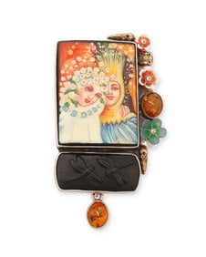 An Amy Kahn Russell sterling silver and amber pendant/brooch