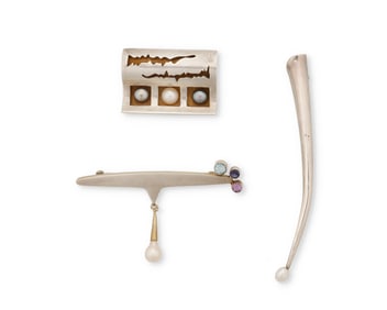 A group of sterling silver modernist jewelry