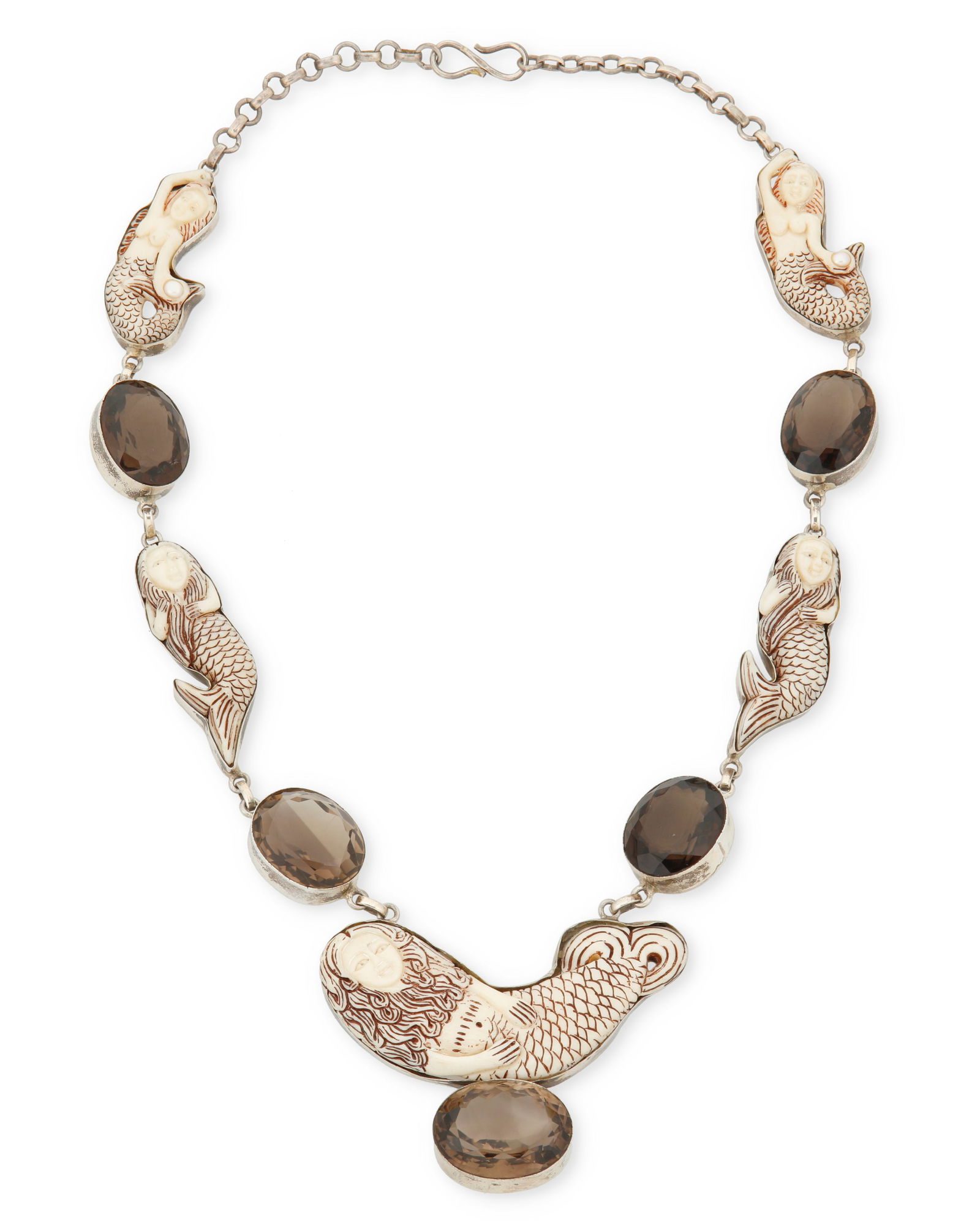 A sterling silver mermaid necklace: A sterling silver mermaid necklaceLate 20th/21st centuryClasp stamped: 925A chunky necklace with multiple mermaid links in carved bone alternating with set faceted smoky quartz24" L x 1.75"