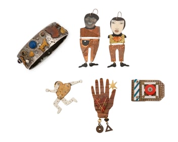 A group of whimsical mixed metal jewelry