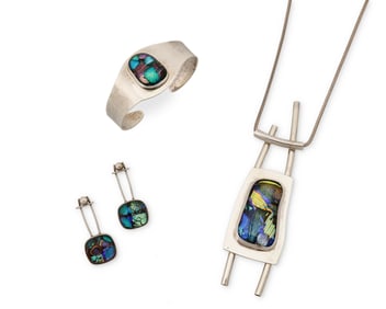 A group of sterling silver and dichroic glass jewelry