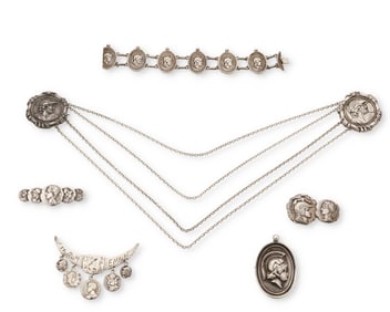 A group of ancient coin-style silver jewelry