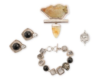 A group of silver and stone set jewelry