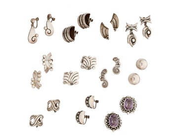 A large group of Mexican silver earrings