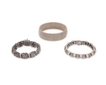 A group of sterling silver bracelets