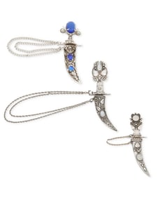 A group of silver saber sword brooches