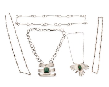 A group of sterling silver necklaces