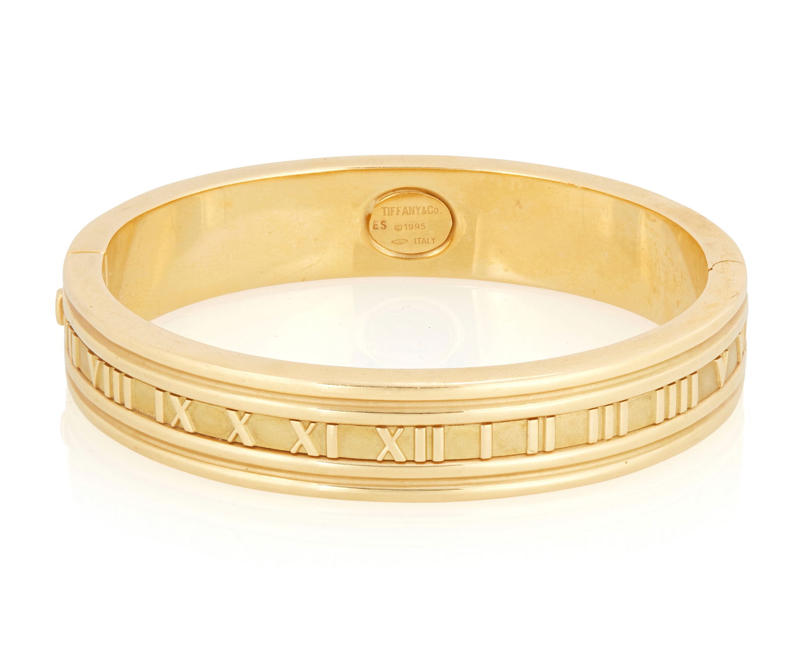 Tiffany & Co.: An 18K Gold "Atlas" Bangle Bracelet (1 of 3)