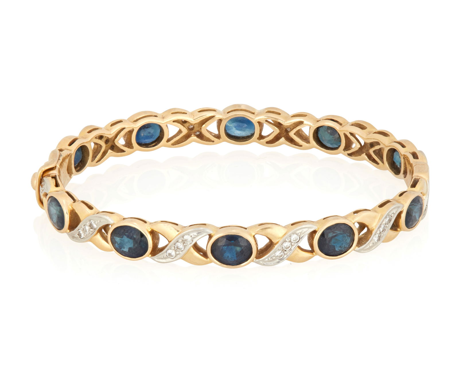 An 18K Bi-Color Gold, Sapphire and Diamond Bangle Bracelet (1 of 3)