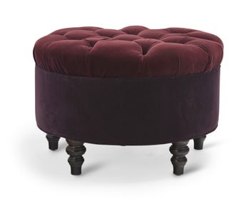 A tufted velvet ottoman