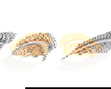 A Pair of 14K Bi-Color Gold and Diamond Earclips: A Pair of 14K Bi-Color Gold and Diamond Earclips Of a feather motif centering a row of graduated single-cut diamonds weighing approximately 0.50 carat 2 pieces Measures: 1 1/2 x 3/4 in. 13.3 grams