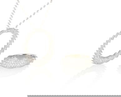 A White Gold and Diamond Ring and Necklace Set: A White Gold and Diamond Ring and Necklace Set Including an 18k white gold ring and pendant set with pave diamonds suspended from a 14k white gold chain 2 pieces Ring: 7 1/2, Chain: 16 in. 12.5
