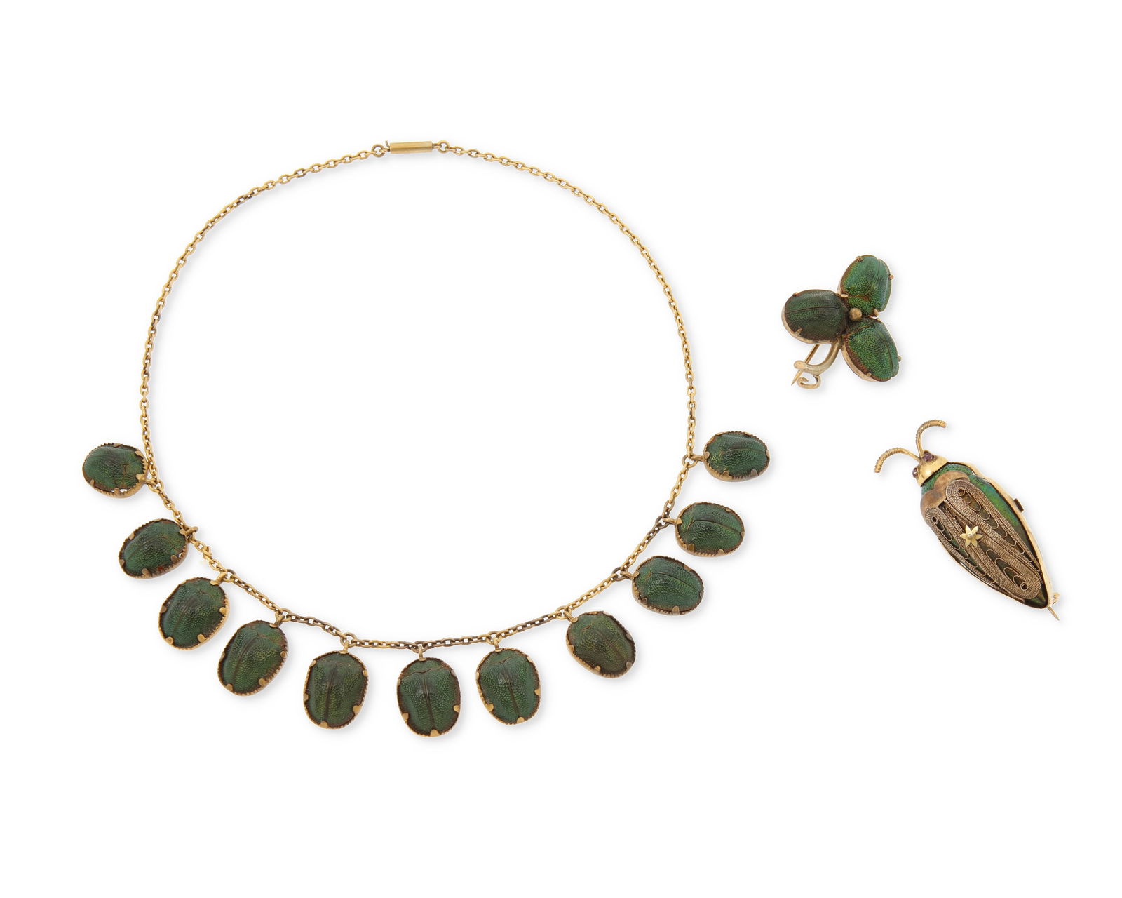 A Group of Gold and Beetle Jewelry: A Group of Gold and Beetle JewelryIncluding a scarab necklace and brooch together with a gold filigree and beetle brooch3 piecesNecklace: 14 in., Brooch: 1 1/2 x 1 1 /4 in. and 2 x 3/4 in.18.0 grams g