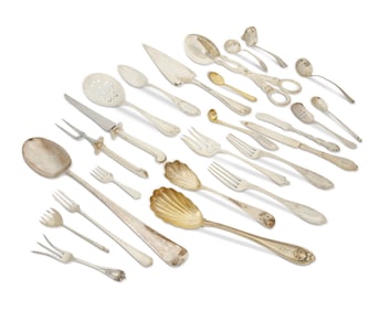 A group of silver and silver-plated flatware items