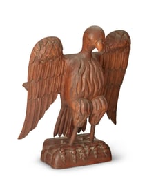 A Folk art carved wood eagle bookstand