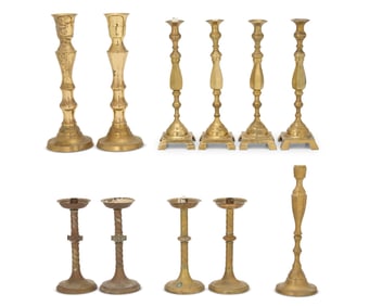 A group of Continental brass candlesticks