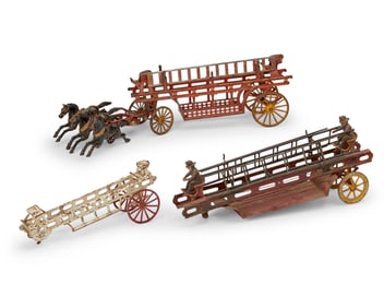 A group of three cast iron firemen toys