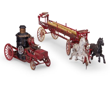 Two cast iron firemen toys