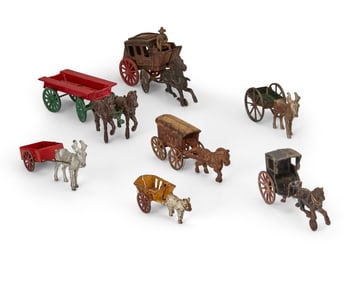 A group of cast metal animal drawn carriage toys