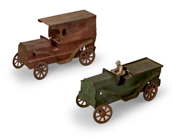 Two Dayton hill climber toy trucks