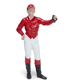 A lawn jockey yard decoration