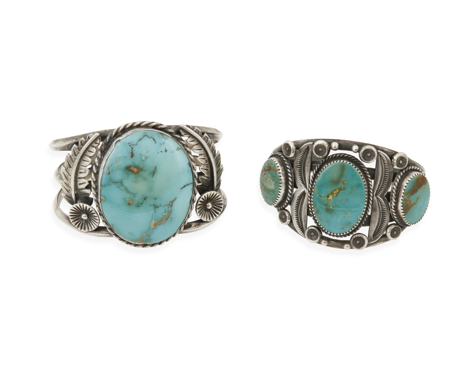 Two Southwest silver and turquoise cuff bracelets: Two Southwest silver and turquoise cuff braceletsLate 20th centurySmaller stamped: E / Sterling [possibly Ella Cowboy, Navajo/Dine]Comprising a three-wire cuff with a large central set turquoise and f