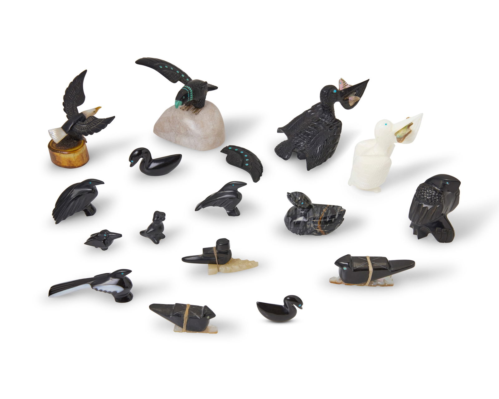 A group of Zuni carved stone bird fetish figures: A group of Zuni carved stone bird fetish figuresMid/late 20th centuryMost variously signed by the artist or marked: ZuniComprising sixteen bird figures from various makers such as Tracy Estate and Jes