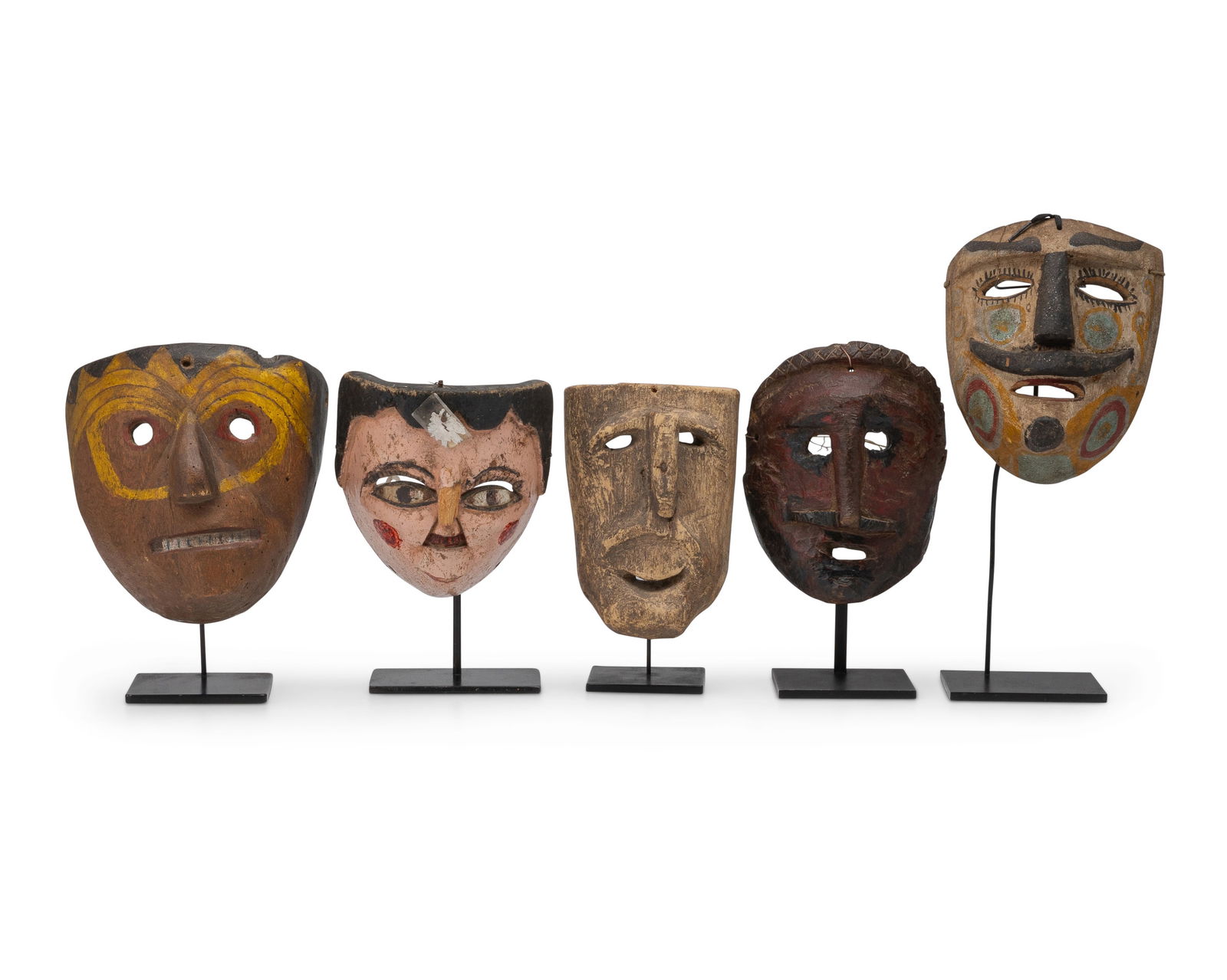 A group of Mexican carved wood masks (1 of 20)