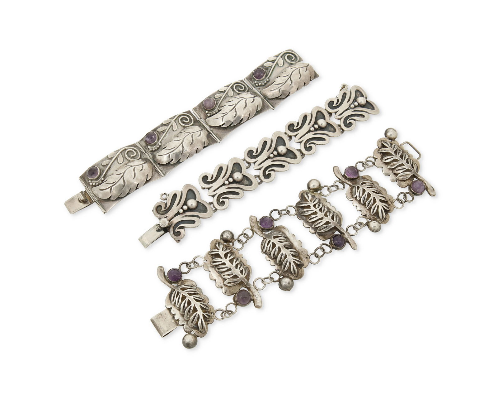 A group of Mexican silver and set stone bracelets: A group of Mexican silver and set stone braceletsMid-20th centuryEach marked for maker, for silver, and for MexicoComprising two Clna [?] silver leaf-motif link bracelets with set amethyst cabochons,