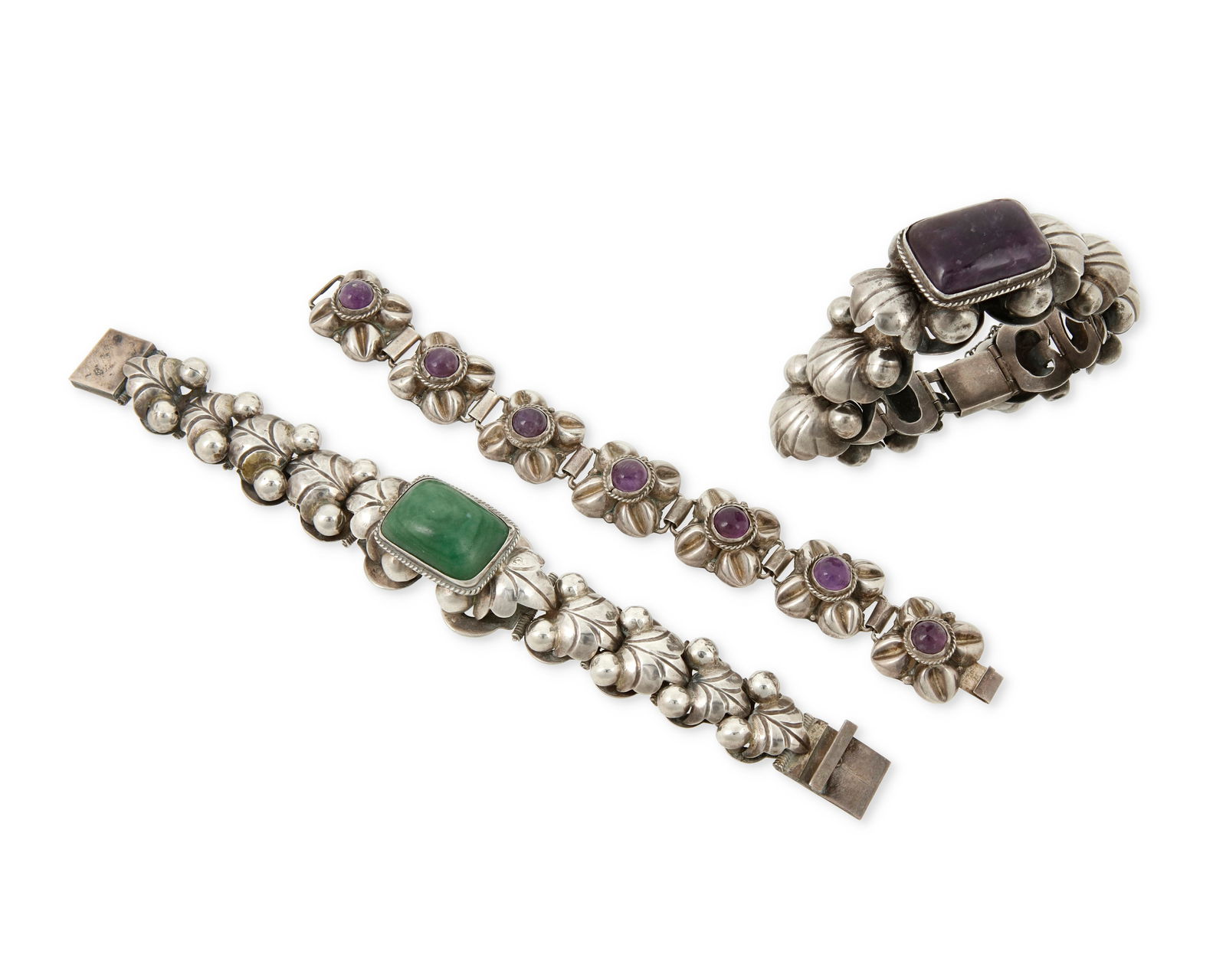 Three Mexican silver and stone set link bracelets: Three Mexican silver and stone set link braceletsMid-20th centuryTwo stamped: Mexico / Silver; one stamped: Sterling / 0.925Comprising two chunky leaf-form graduated link bracelets, each with a large