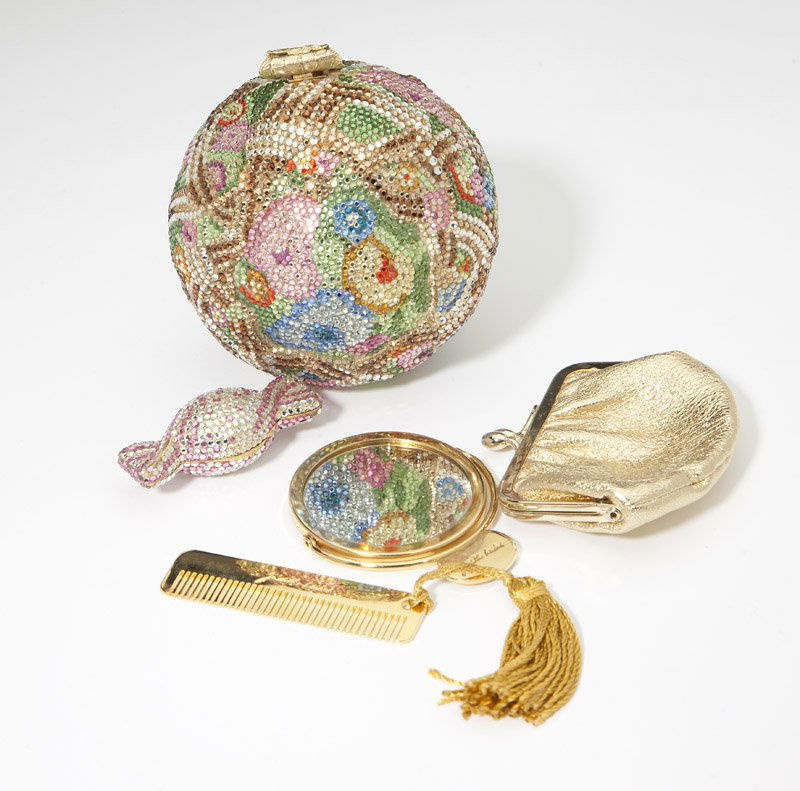 A floral bud minaudiere & pillbox, Judith Leiber: Each item signed Judith Leiber; multi-colored crystal floral bud minaudiere comes with chain, coinpurse, mirror, and comb still in tissue; candy pillbox set in pink and white crystals approx .75'' H x
