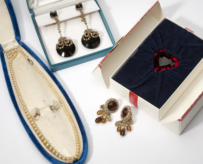 A collection of costume jewelry;: A pair of earrings by Mariam Haskell, a pair of costume earrings, a faux pearl necklace and earrings with gold clasp and screw-backings and a large red Swarovski heart, 8 pcs, est:$200/300