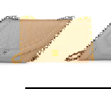 CHANEL: A Beige Quilted Lambskin Small Diana Shoulder Bag: CHANEL: A Beige Quilted Lambskin Small Diana Shoulder Bag Circa 1990s; France Marked to interior: Chanel / Copr / Made in France; tag and card: 1804647 In soft beige diamond matelasse leather with