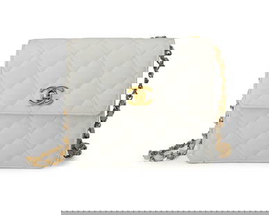 CHANEL: A Vintage White Caviar CC Matelasse Mini Square Shoulder Bag: CHANEL: A Vintage White Caviar CC Matelasse Mini Square Shoulder Bag Circa 1991-1994; Italy Marked to interior: Chanel / Copr / Made in Italy; tag: 230__68 A small pebbled white quilted leather bag