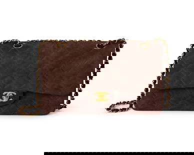 CHANEL: A Brown Quilted Suede Medium Classic Double Flap Shoulder Bag: CHANEL: A Brown Quilted Suede Medium Classic Double Flap Shoulder Bag Circa 1990s; France Marked to interior: Chanel / Copr / Made in France; tag: 2922663 A double flap diamond matelasse bag with a