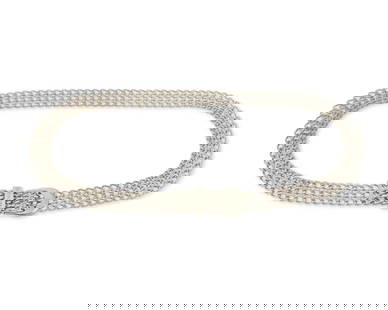 CHANEL: A Vintage Silver-toned Metal Chain Link Belt: CHANEL: A Vintage Silver-toned Metal Chain Link Belt Circa 1997; France Marked to oval plaque: Chanel / Copr / Made in France / 97P A dark silver tone "chainmaille" style belt with three