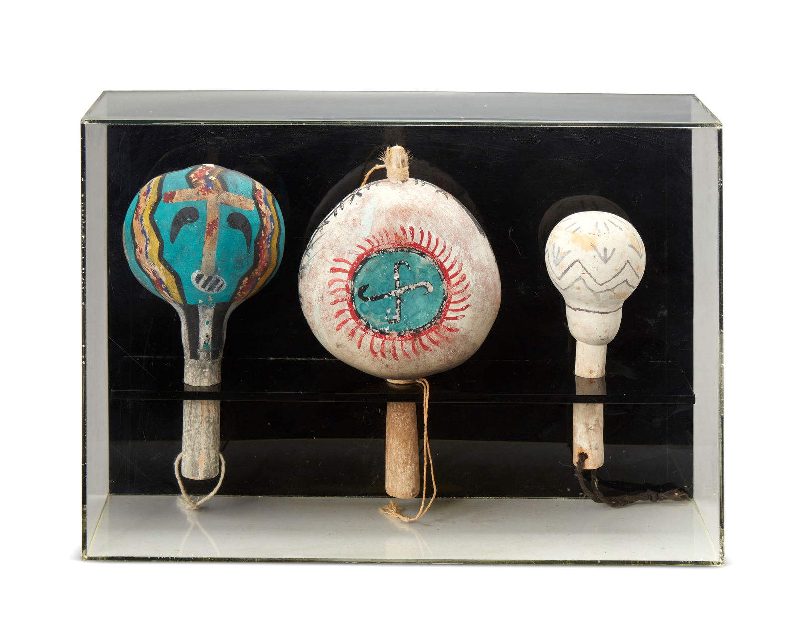 A group of Hopi polychrome gourd dance rattles (1 of 3)