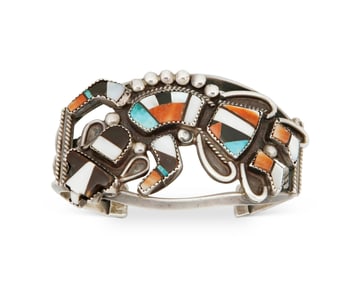 A Zuni Rainbow Dancer silver and stone inlay cuff bracelet