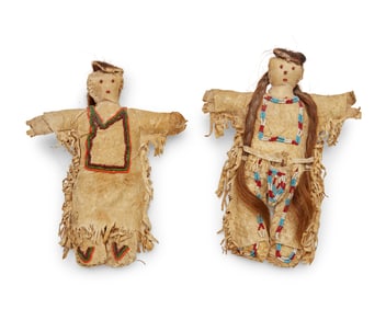 Two Plains beaded hide dolls