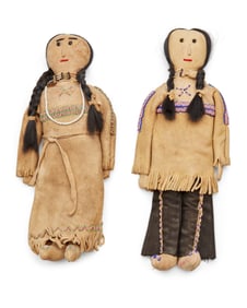 Two Native American beaded hide dolls