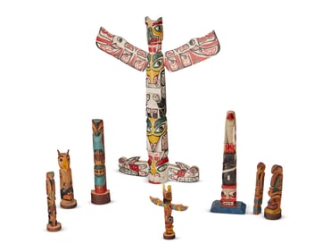 A group of Northwest Coast polychrome totems