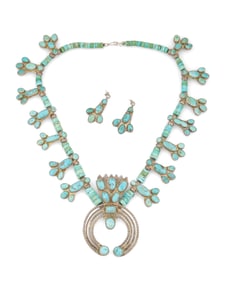 A set of Southwest silver and turquoise squash blossom jewelry