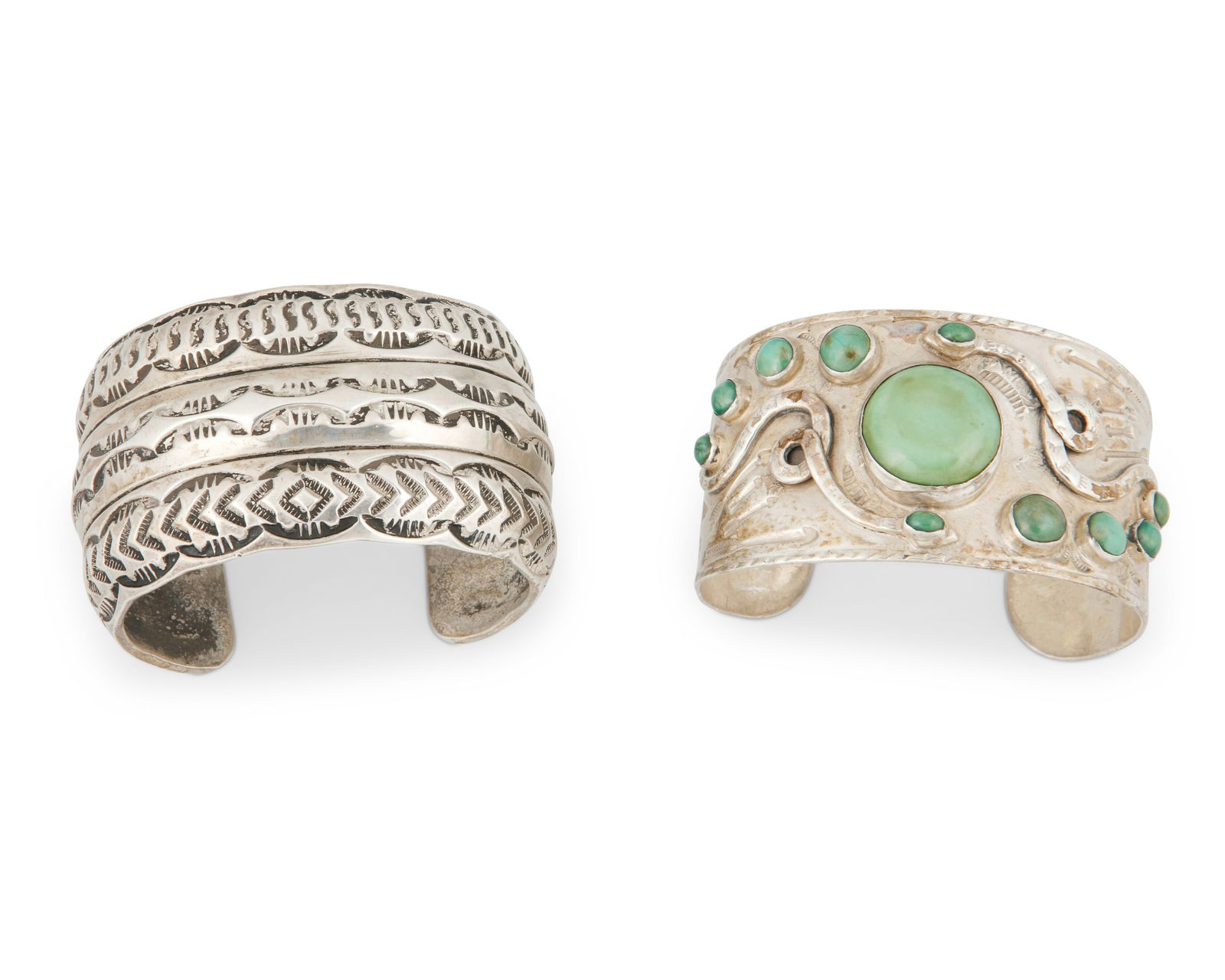 Two Southwest silver cuff bracelets: Two Southwest silver cuff braceletsMid/late 20th centuryOne marked: T. Jon / SterlingComprising a Tillie Jon Navajo/Dine heavy sterling silver cuff with banded stamping, and a wide tapered cuff with s