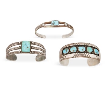 A group of Southwest silver and stone set cuff bracelets