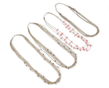 A group of Southwest Pueblo-style silver necklaces including Ed Aguilar