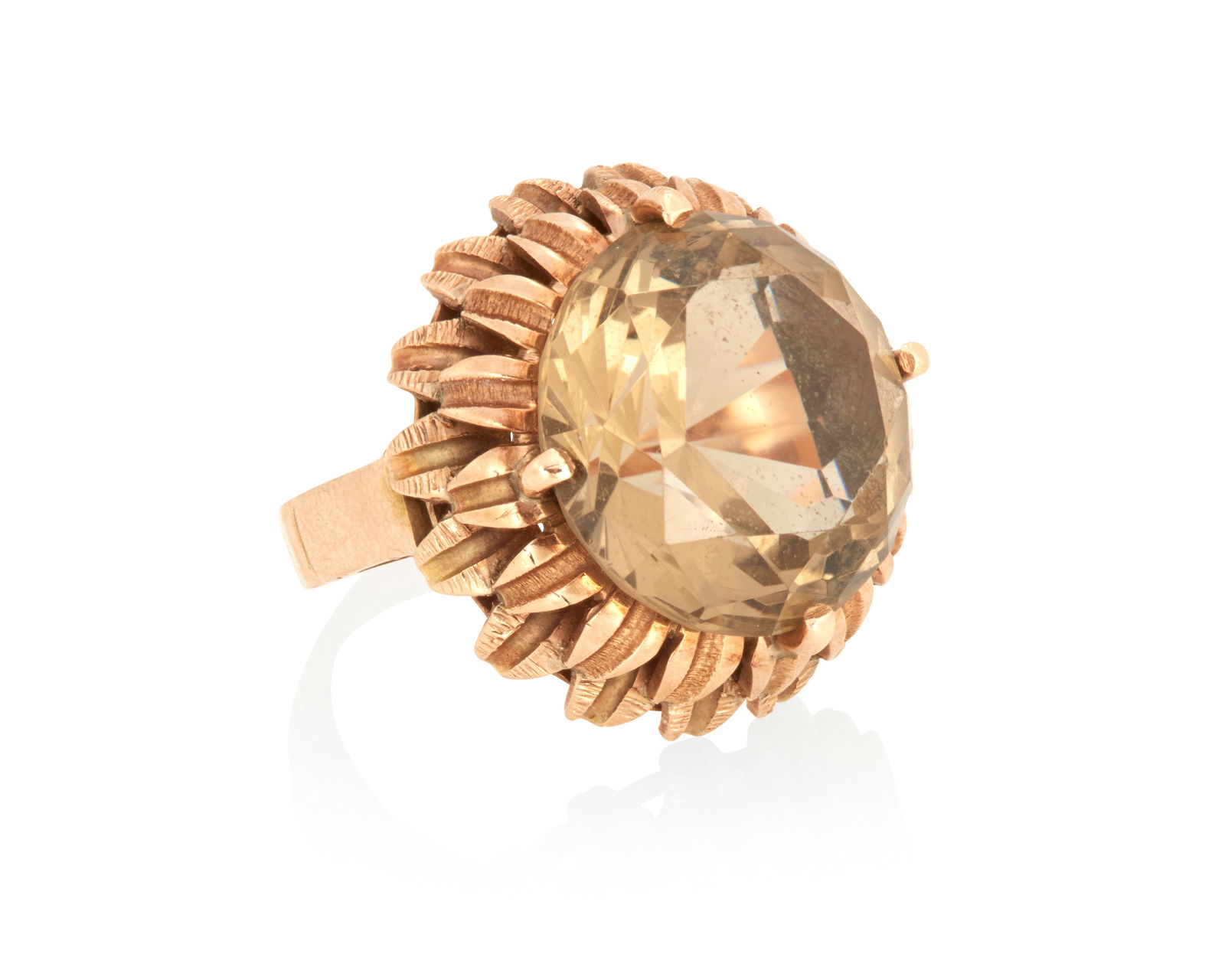 A Gold and Citrine Ring: A Gold and Citrine RingOf a floral design centering a round citrine weighing approximately 10.20 caratsSize: 4 1/48.4 grams gross