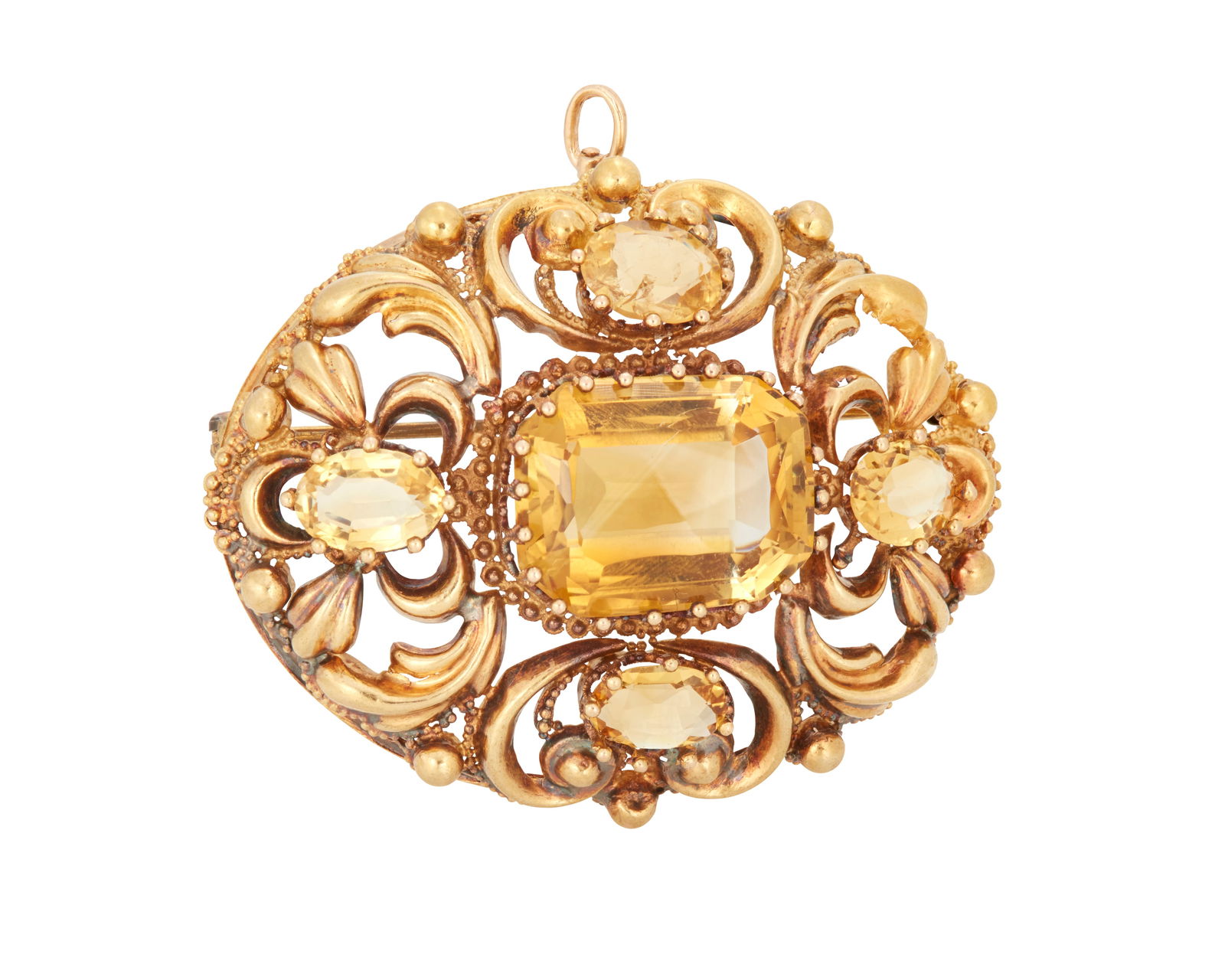 A Turn of the Century Gold and Citrine Pendant/Brooch: A Turn of the Century Gold and Citrine Pendant/BroochCentering a cushion-cut citrine measuring approximately 18.00 x 13.50 mm, accented by four smaller oval citrines set in an ornate 20k gold frameMea